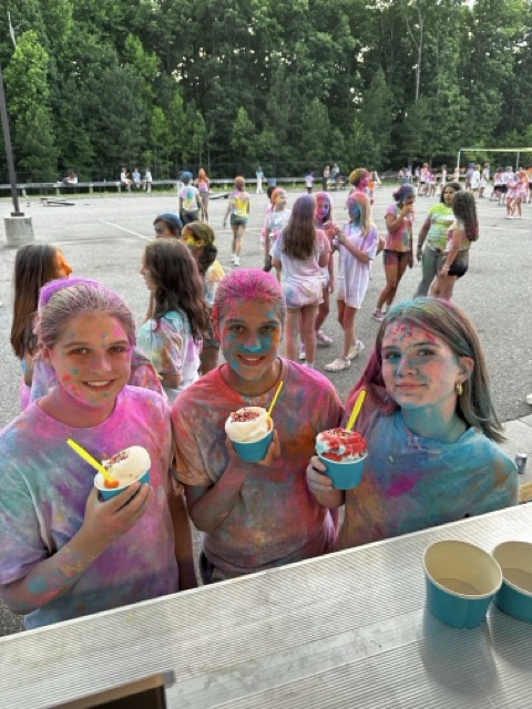 Happy students with Italian ice at a school color run