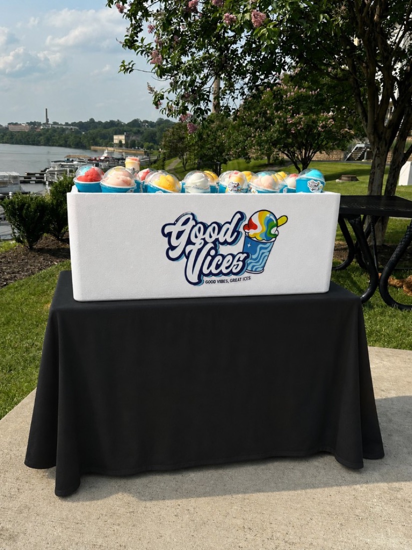 Branded Good Vices foam cooler full of pre-scooped Italian ice cups, delivered on a table