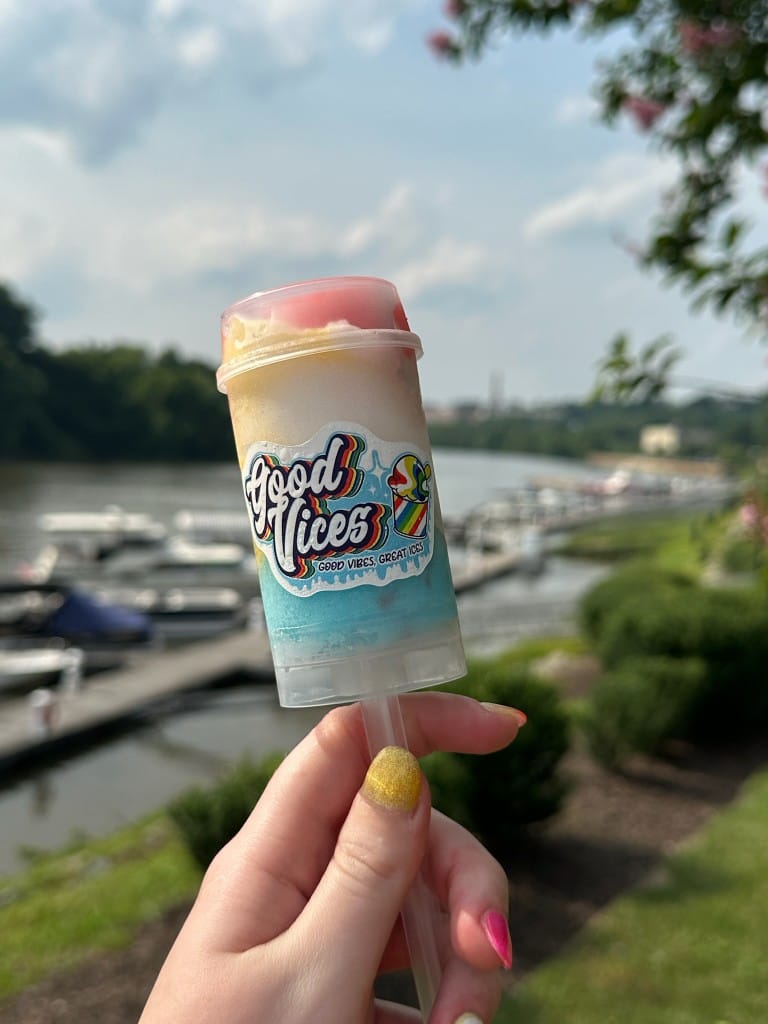 Good Vices Rocket Pop Italian ice push pop held up by the James River in Richmond
